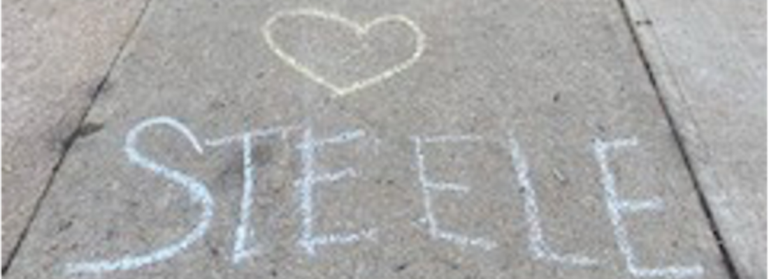 Steele written on the sidewalk with chalk